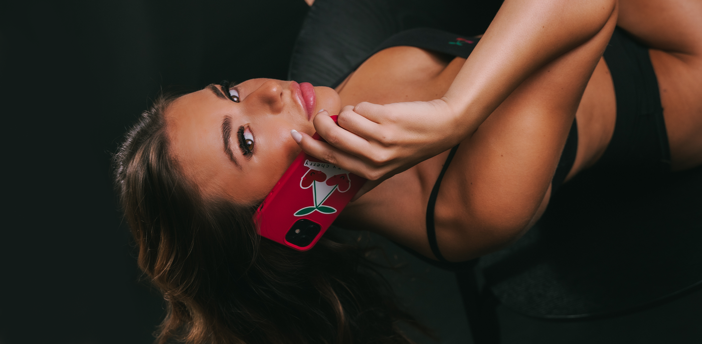 image of model wear cheeky cherry set with phone in hand to contact us to join our team
