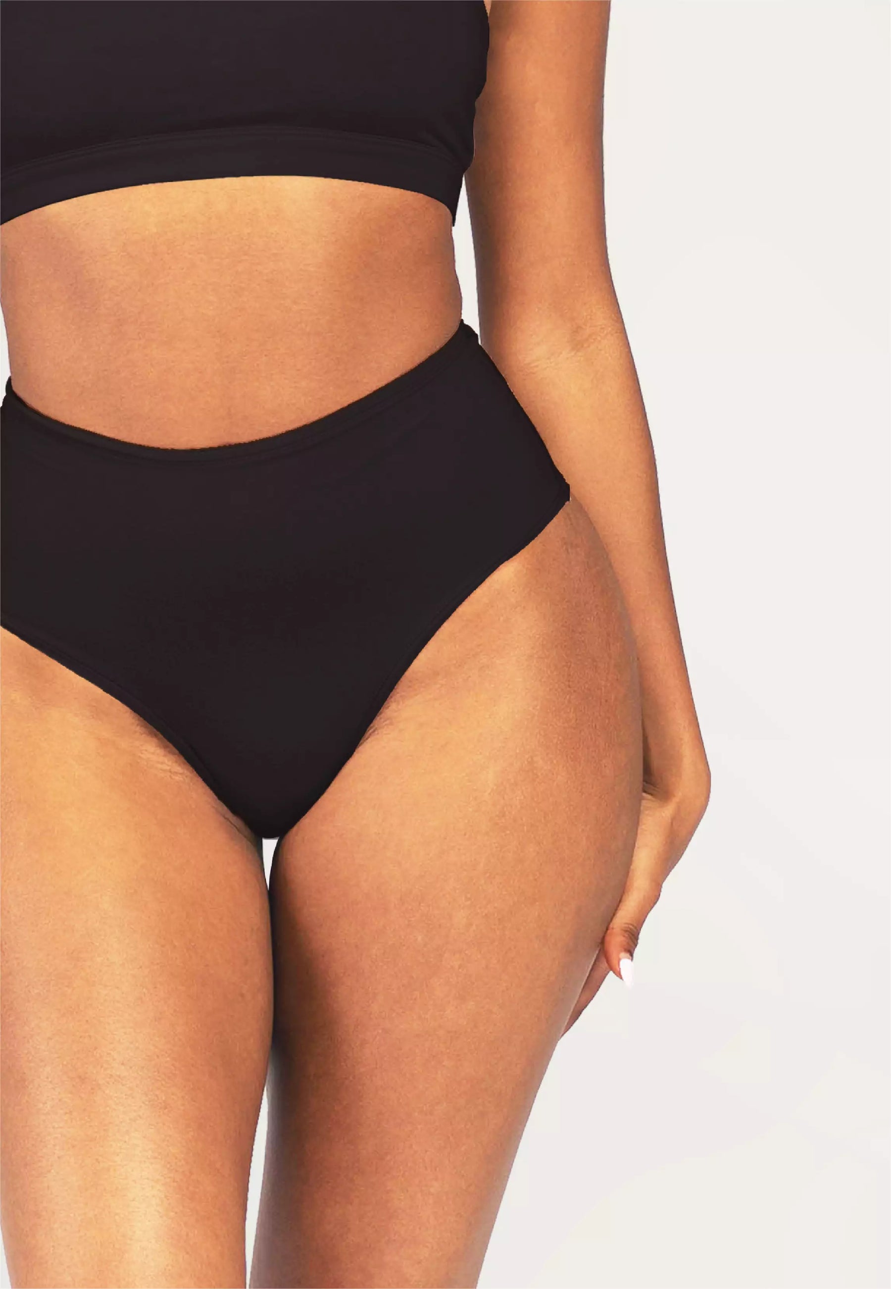 Cheeky Cherry high-waisted leakproof period underwear in black, offering full coverage and featuring a small cherry logo on the front. Perfect for absorbent, comfortable, and reliable period protection.